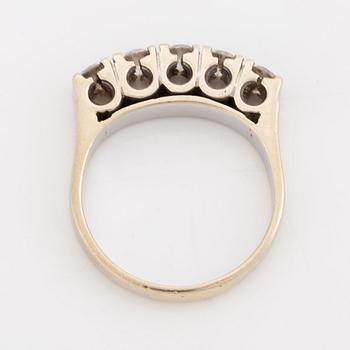 A 14K gold ring set with round brilliant-cut diamonds.