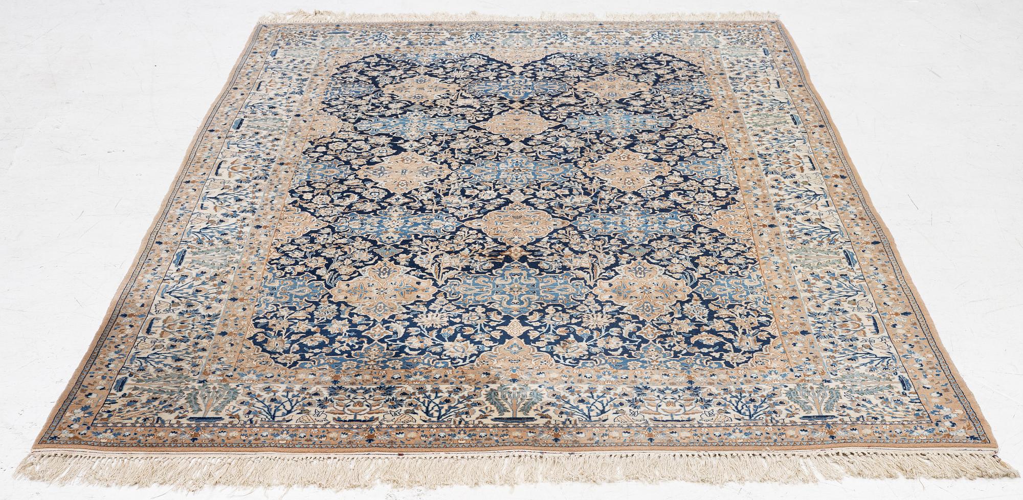 A semi-antique Nain carpet, part-silk, c. 261 x 175 cm.