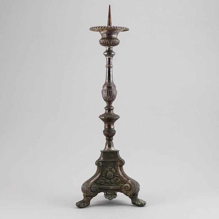 An 18th century bronze candlestick.