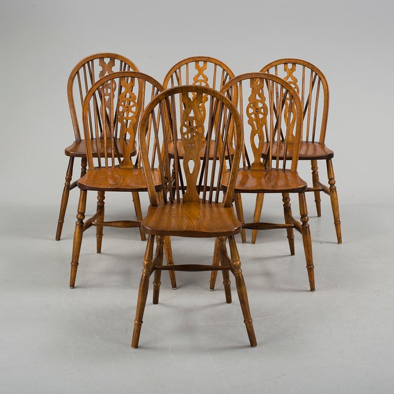 Six oak chairs from Reprodux, second half of the 20th century.