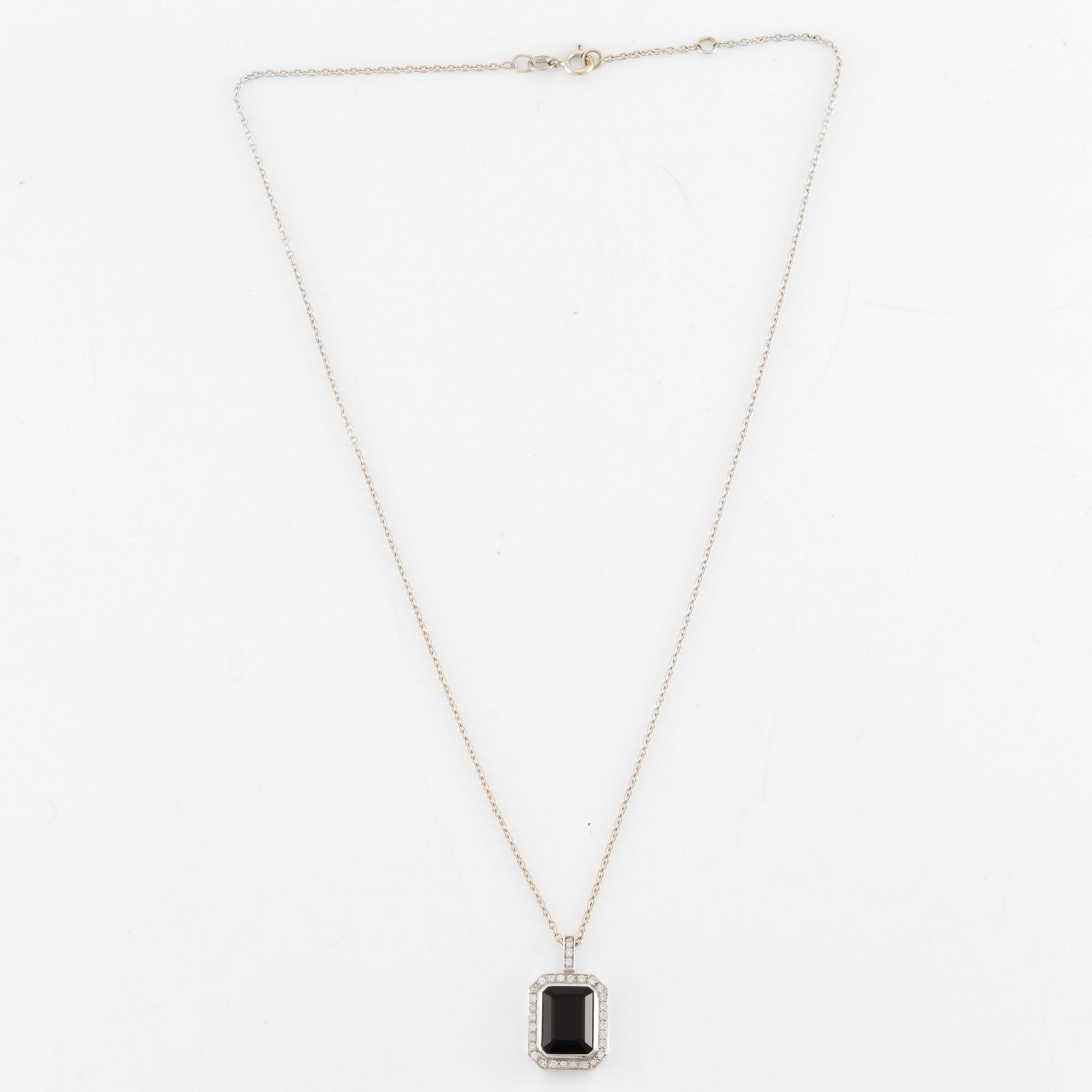 Pendant in 18K white gold set with brilliant-cut diamonds and likely onyx, with chain.