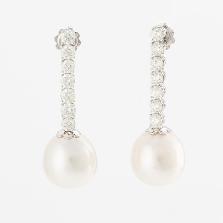 A pair of earrings in 18K white gold with cultured South Sea pearls and round brilliant-cut diamonds.