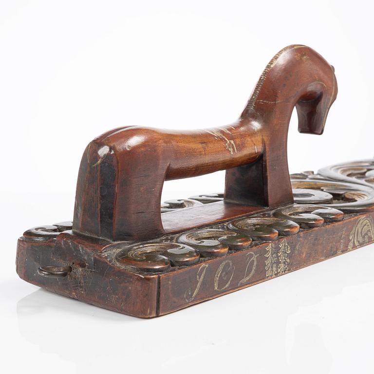 A carved and polychrome painted mangle board, Sweden, late 18th / early 19th century.