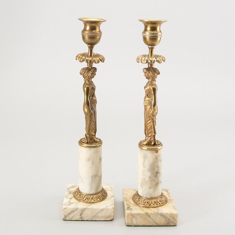 A pair of Gustavian style candle sticks around 1900.