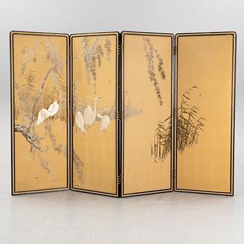 A Japanese silk embroidered four panel folding screen, first half of the 20th century.