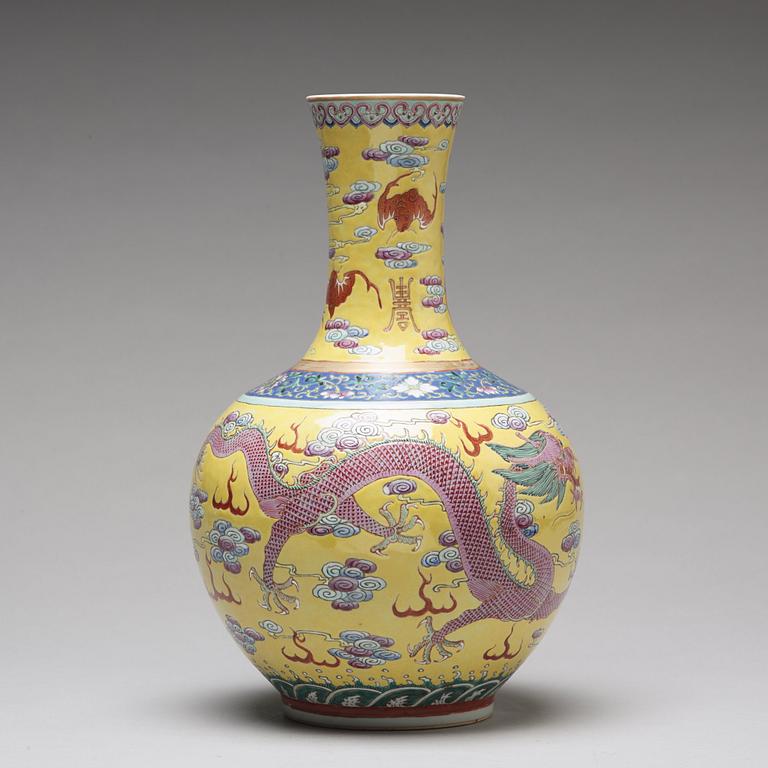 A yellow glazed five clawed dragon vase, probably late Qing dynasty with Guangxus mark.