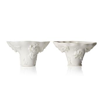 1282. A set of two blanc de Chine 'libation' cups, Qing dynasty, 18th century.