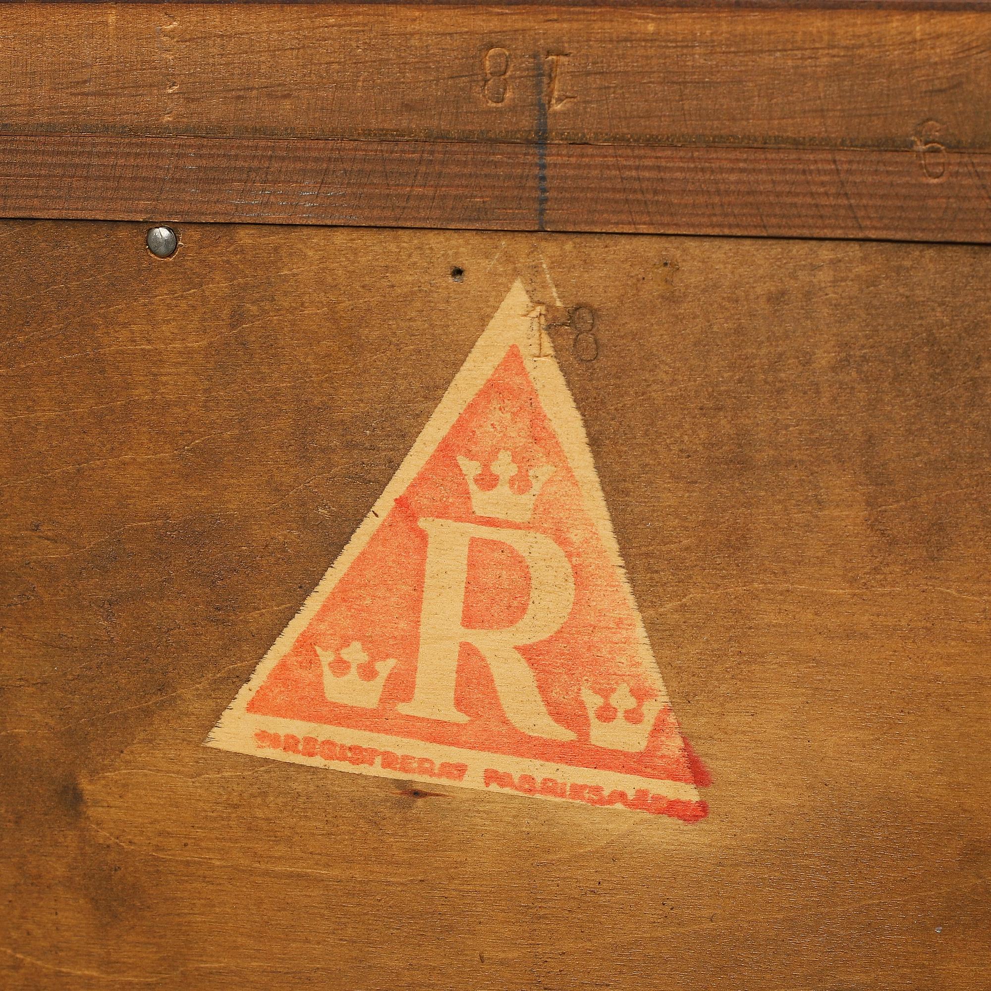 A Baroque style oak cabinet dated 1947.