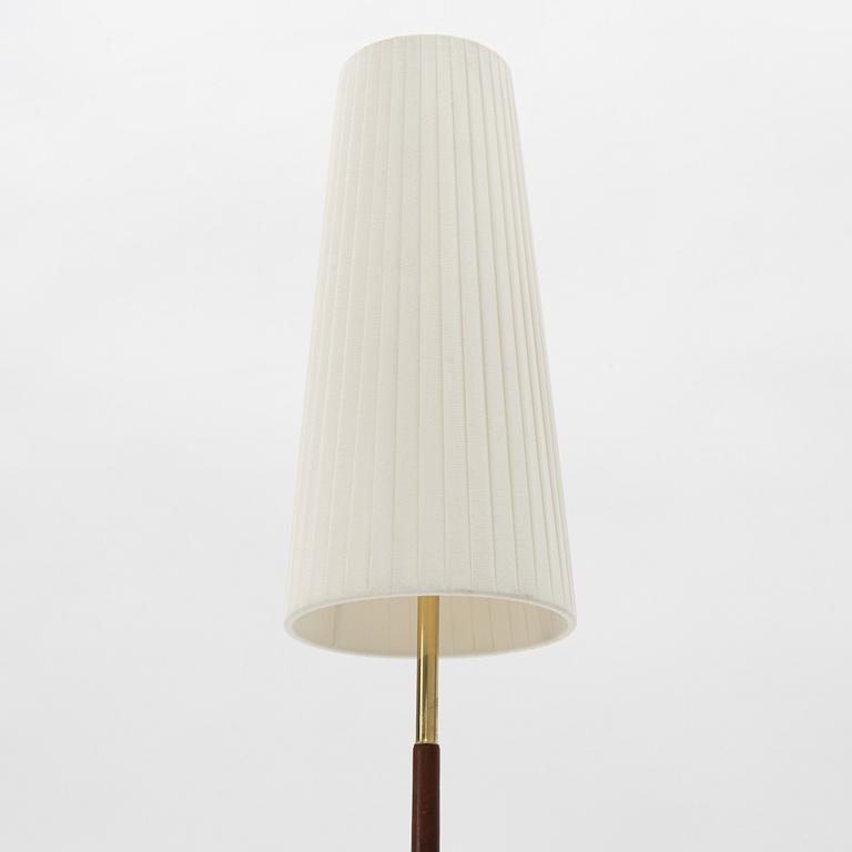 A 1960s teak floor lamp.