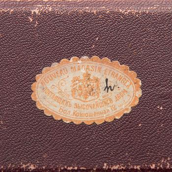 A silver case, Nikolai Kemper, and a pen and a paper knife in silver and enamel, import marks St Petersburg early 1900s.