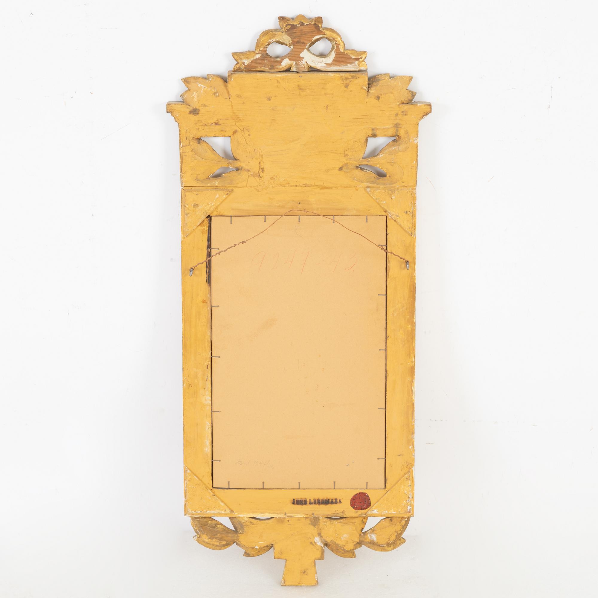 A Gustavian style mirror by John Lundmark, 20th Century.