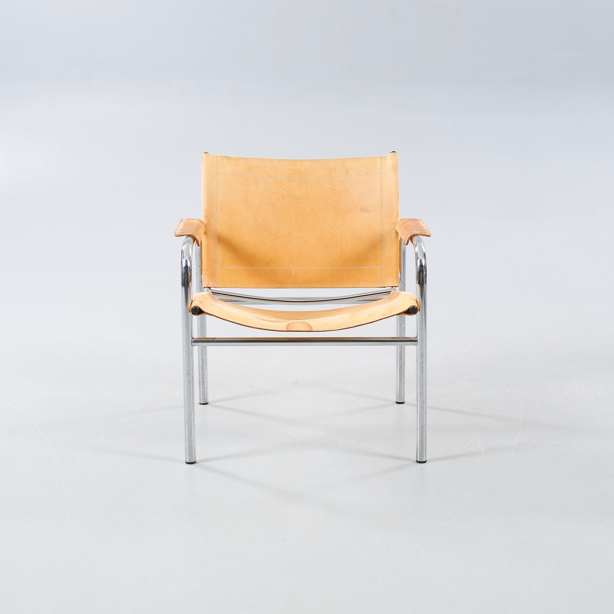 An armchair designed by Tord Björklund, named "Klinte" and made in the fourth quarter of the 20th century.
