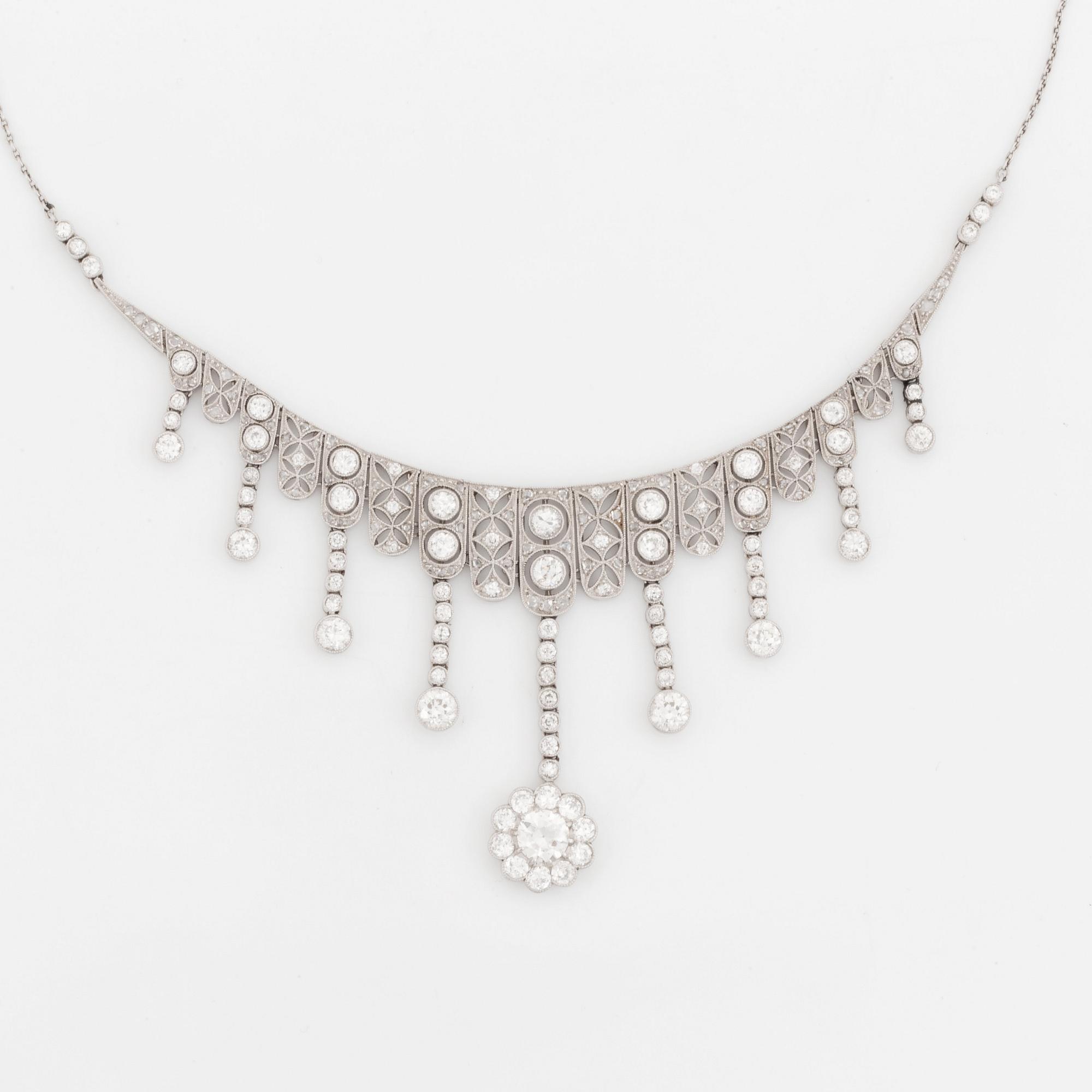 A platinum necklace set with old- and rose-cut diamonds.