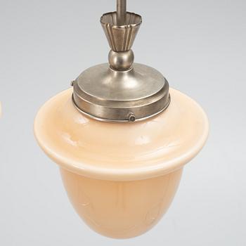 Three Swedish Grace ceiling lamps, 1920's.