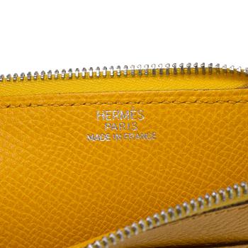 Wallet by Hermès.