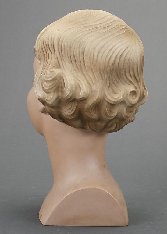 SKYLTDOCKA, huvud, 1900-talets första hälft.