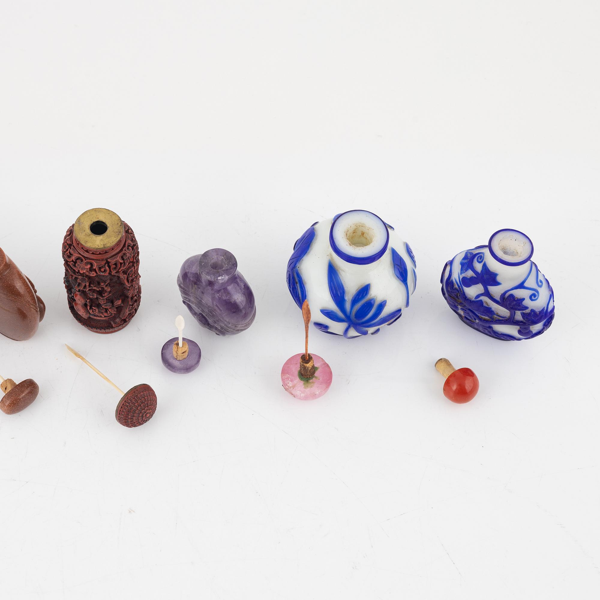 Nine snuff bottles, Peking glass, lacquer, stone and mother of pearl, China, 20th century.