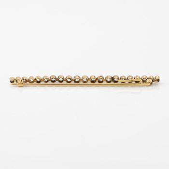 A brooch/pendant, pin, gold and platinum set with old-cut diamonds.