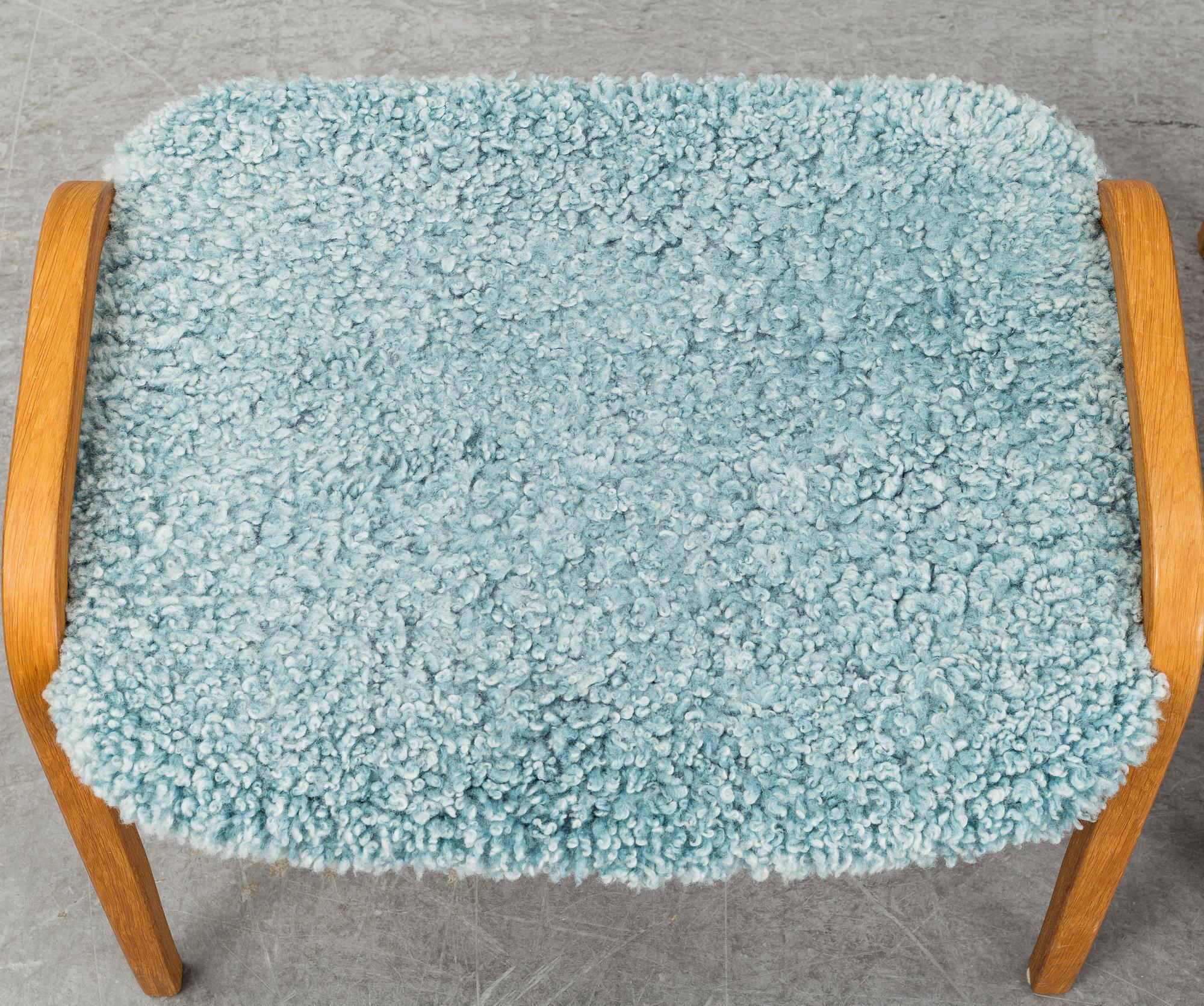 YNGVE EKSTRÖM, a 'Lamino' armchair with a stool, Swedese.