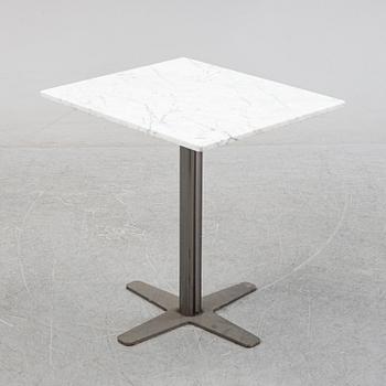 A marble top table, 21th century.