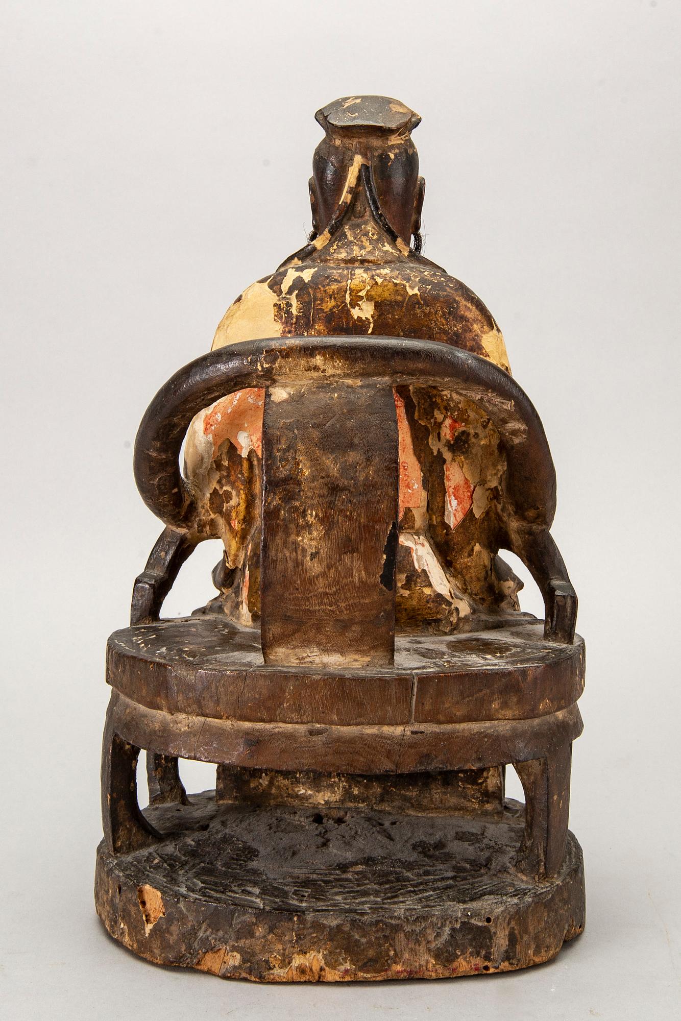 A Chinese late Qing painted wooden sculpture.