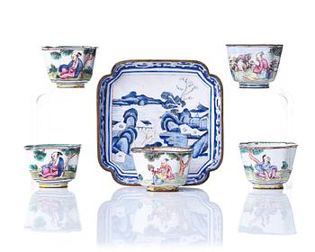 670. A set of five enamel on copper tea cups and a dish, Qing dynasty, circa 1800.