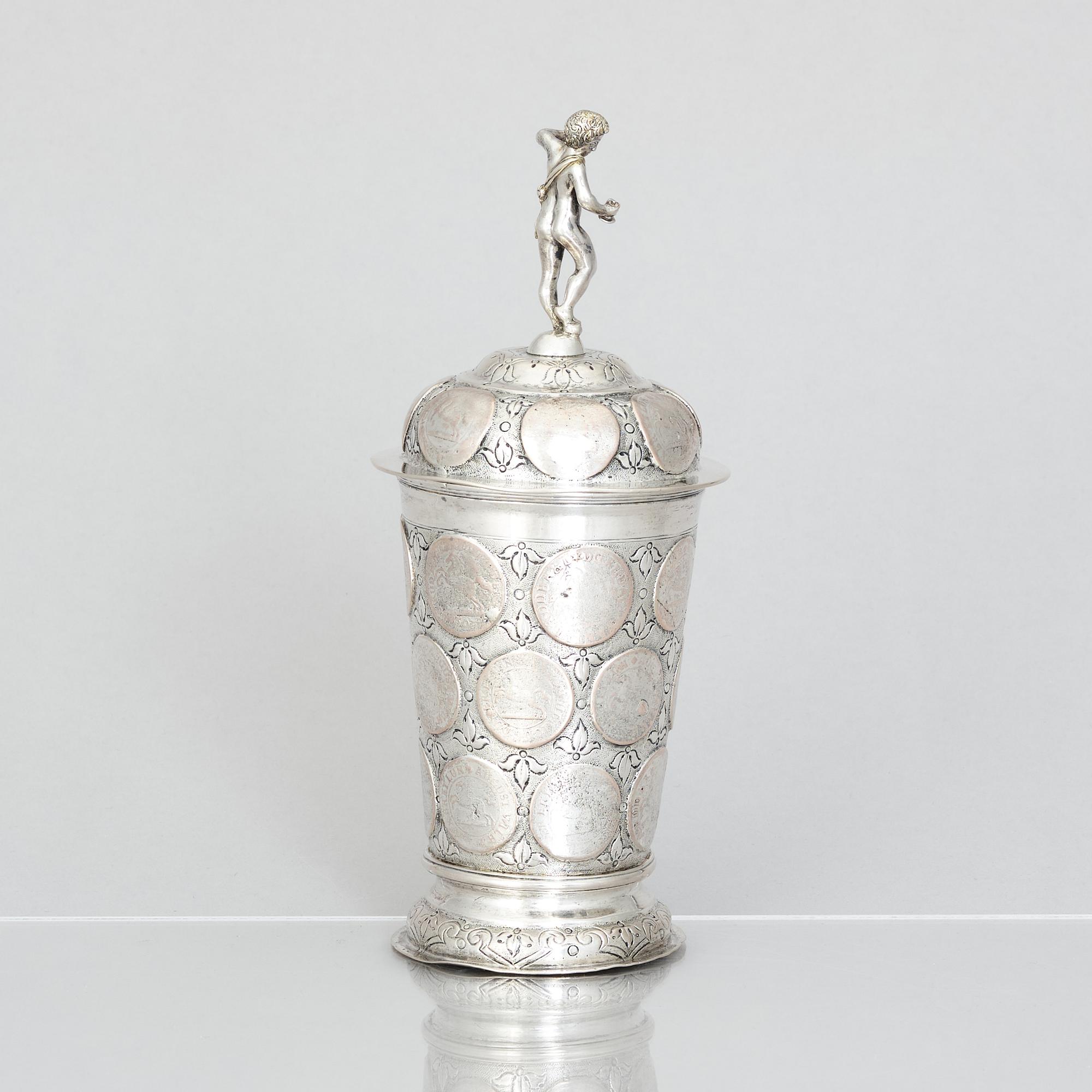 An 19th century parcel-gilt silver cup with lid, unidentified makers mark, probably Nürnberg.