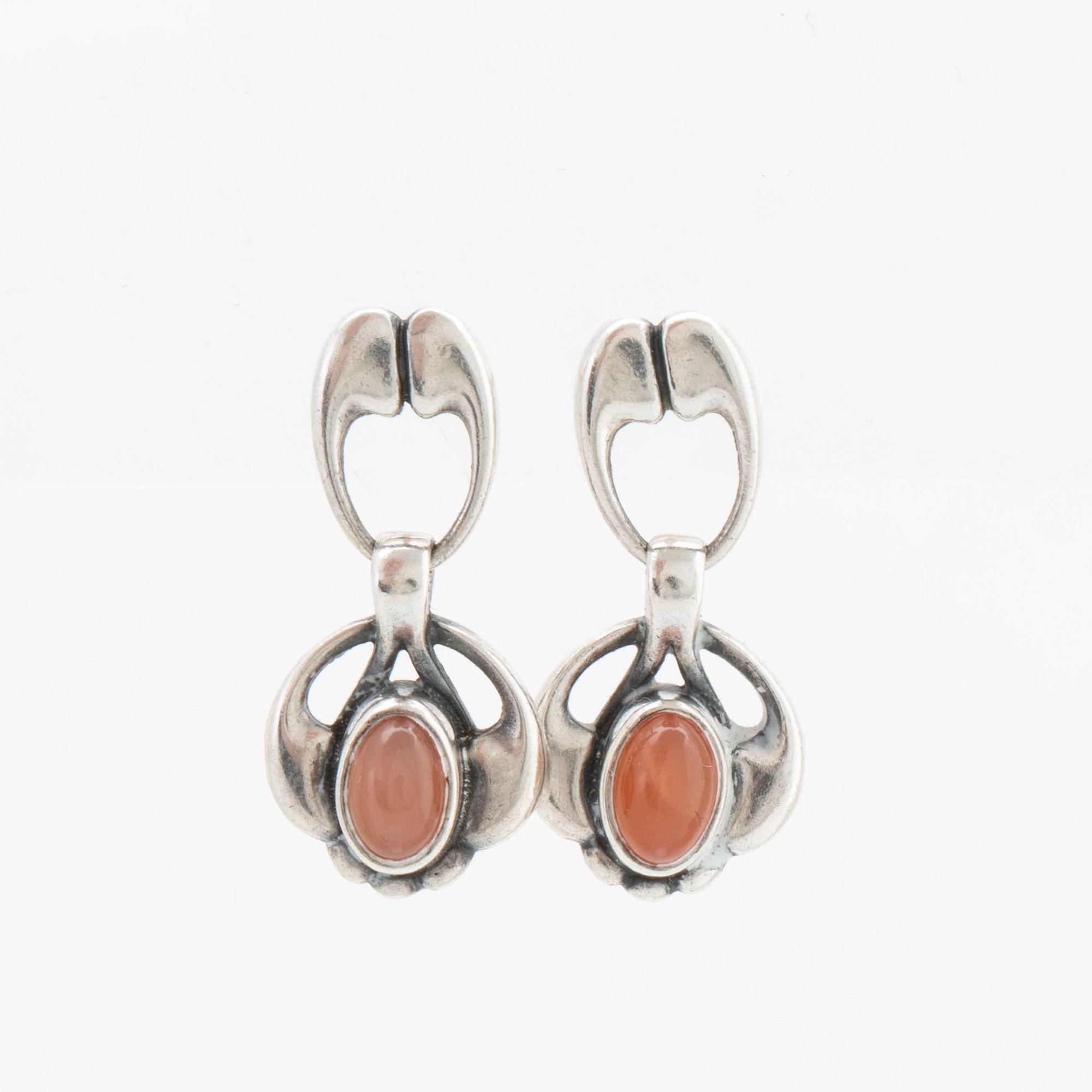 A silver and moonstone jewellery set consisting of necklace and earrings by Georg Jensen, jewellery of the year 2006.