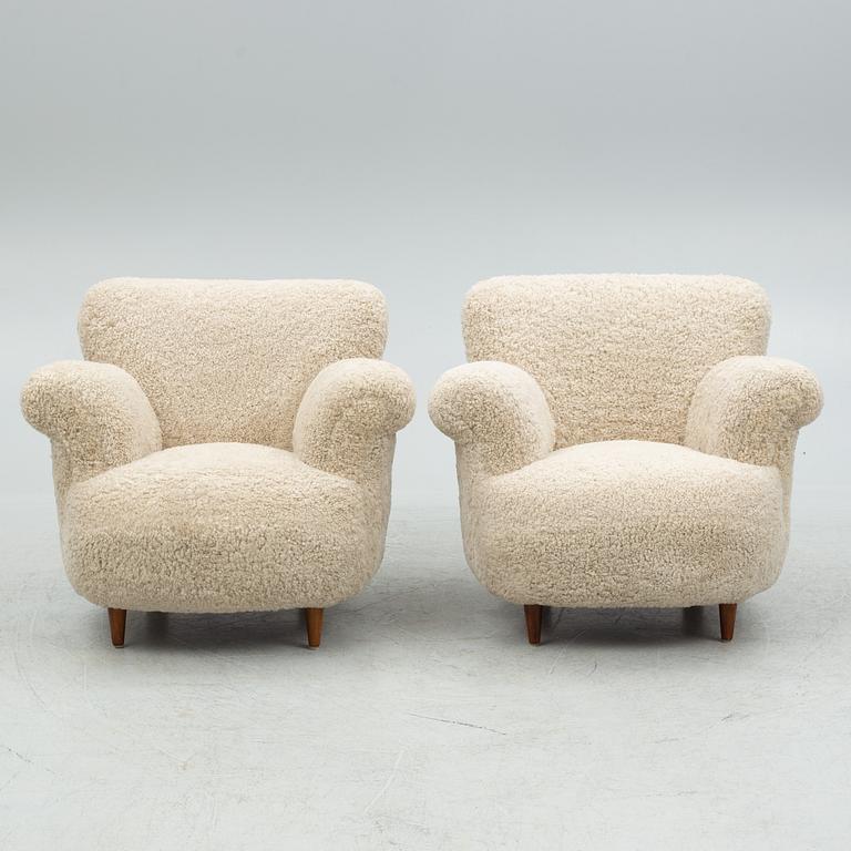 A pair of Swedish Modern easy chairs, mid 20th century.