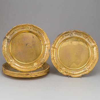 A set of nine silver-gilt sterling plates, Mexico 20th century. Rococo-style.