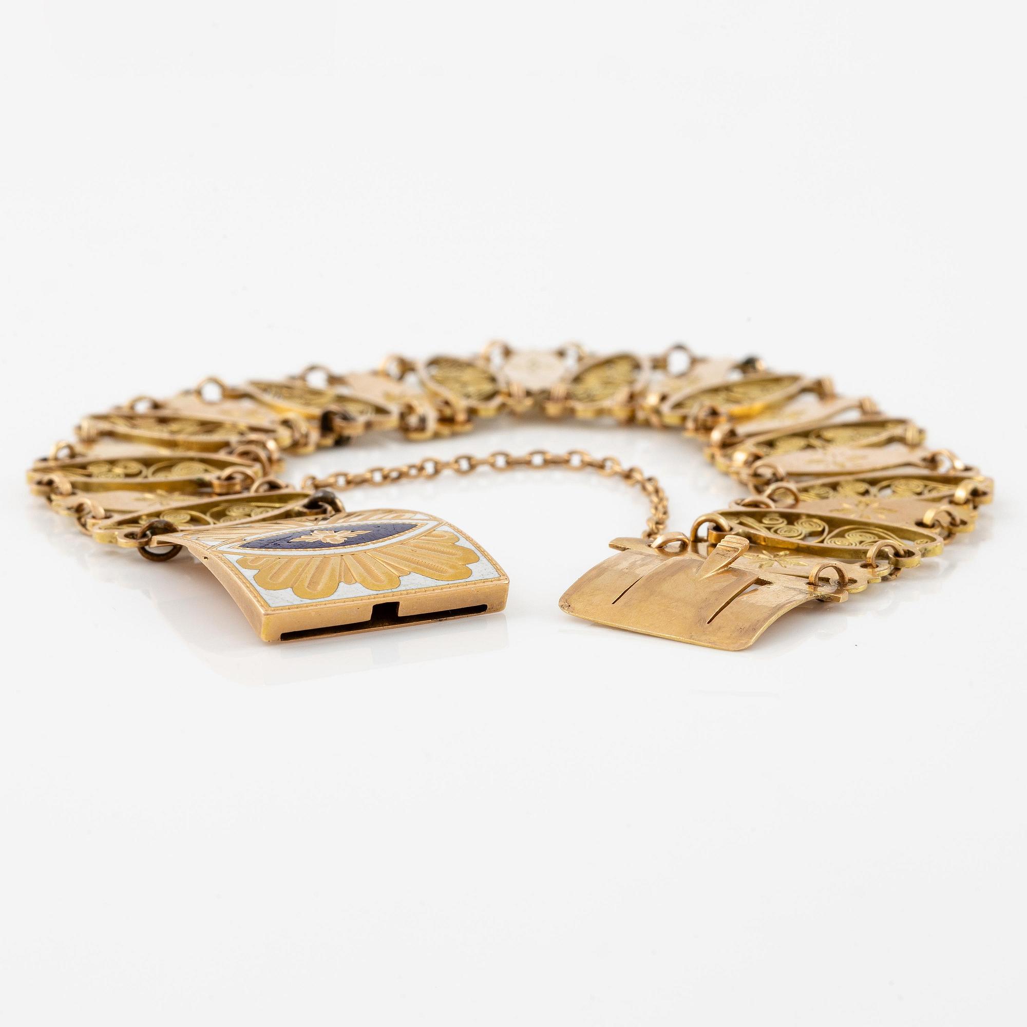 A bracelet in 18K gold with enamel details.