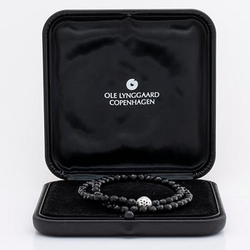 OLE LYNGGAARD necklace, onyx beads approx 6 mm, clasp 18K whitegold approx 10 mm, CL 750 inscribed, original case.