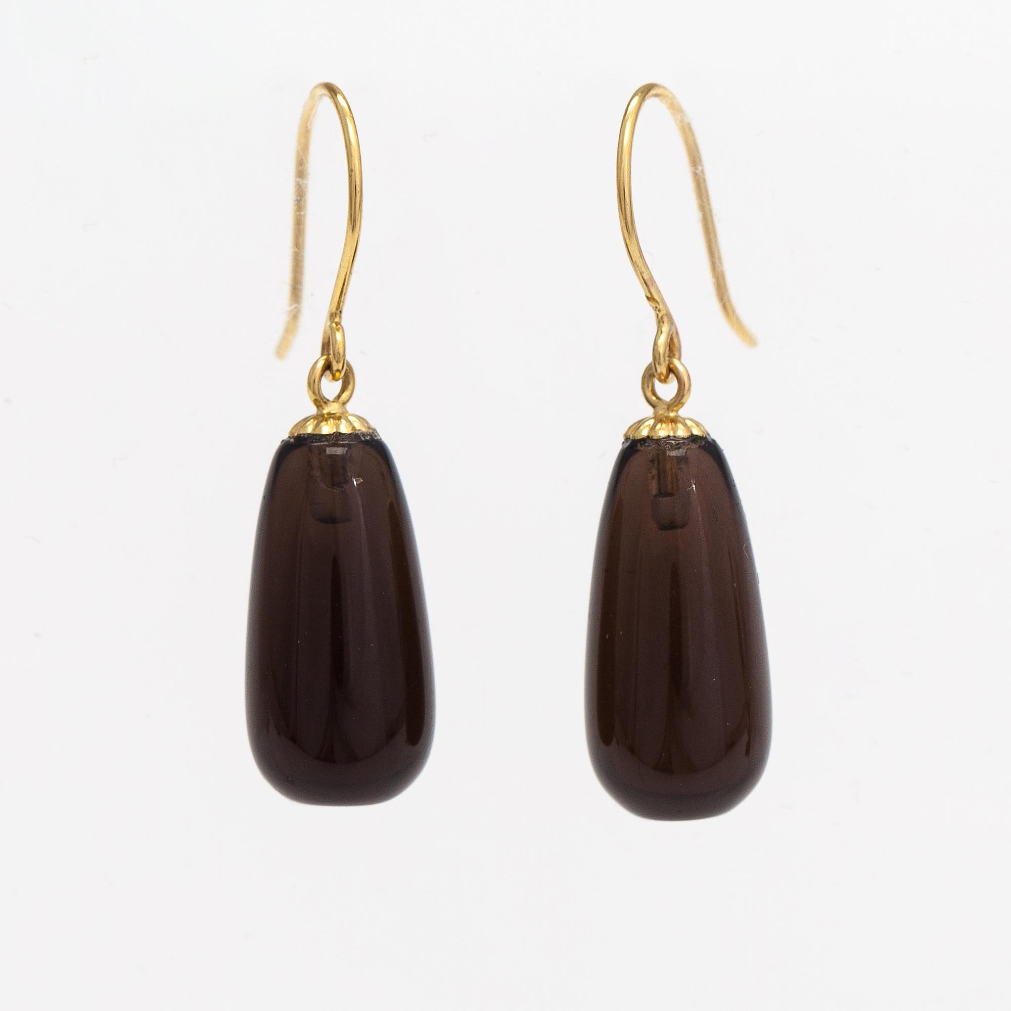 A pair of 14K gold earrings with smoaky quartzes.