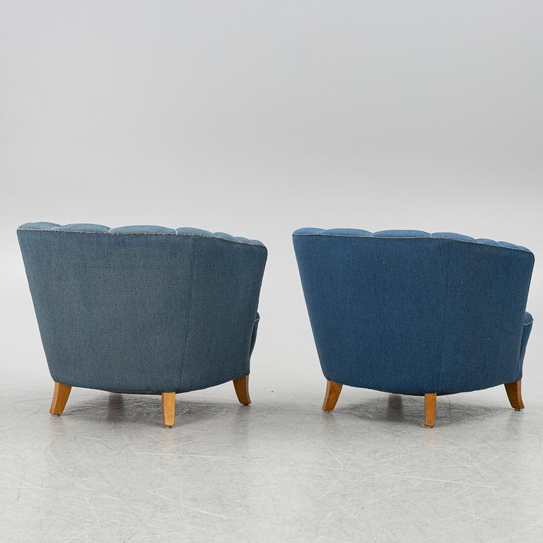 A pair of 1950's armchairs.