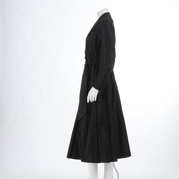 A black silkcoat from Nordisk Kompaniet 1916.