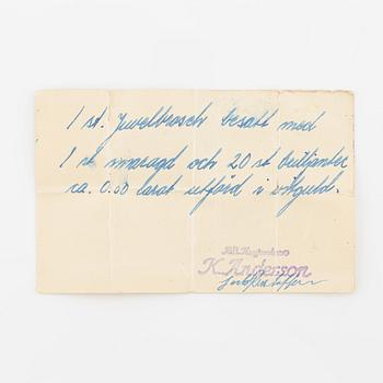 Brosch vitguld med smaragd och  diamanter.