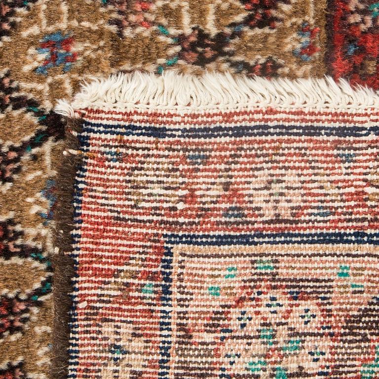 AN old Koliai carpet ca 240 x 131 cm.