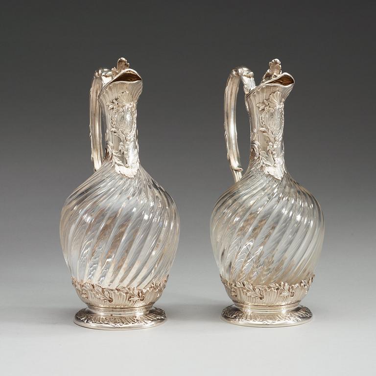A pair of French late 19th century silver and glass wine-flagons.