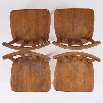 Axel Einar Hjorth, a set of four stained pine "Utö" chairs, Nordiska Kompaniet, Sweden, 1930s.