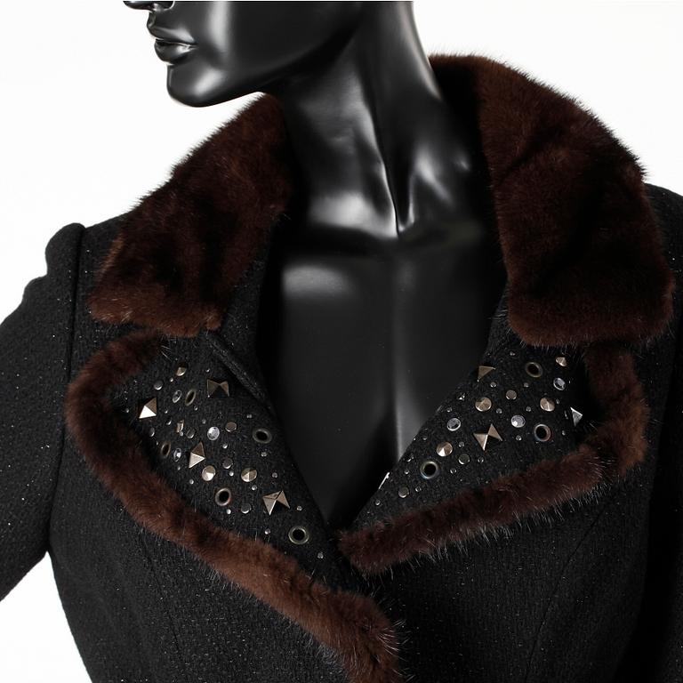 BLUMARINE, a black wool jacket with mink fur.