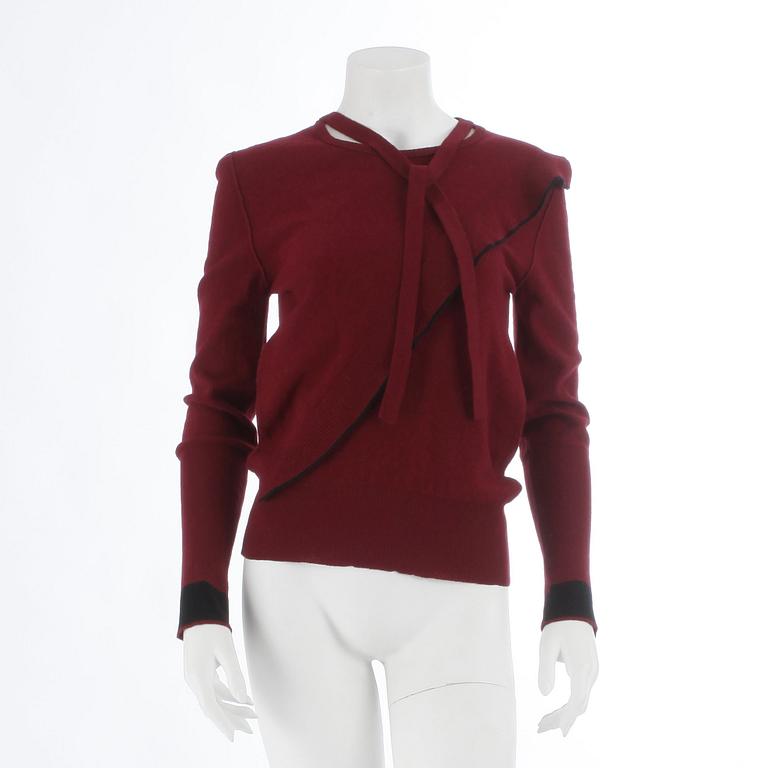 SONIA RYKIEL, a burgundy red wool sweater.