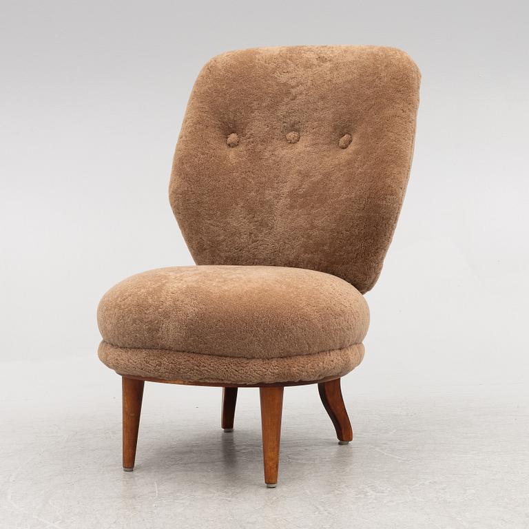 A mid 20th century easy chair,.