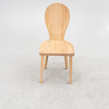 Carl Malmsten, a "skedblad" chair, Tre Sekel, Sweden, 21st century.