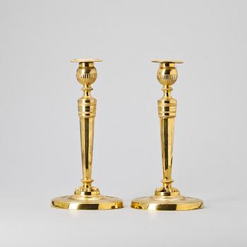 A pair of French Empire early 19th Century candlesticks.