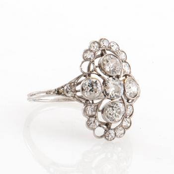 Platinum ring set with round old-cut diamonds, early 20th century.