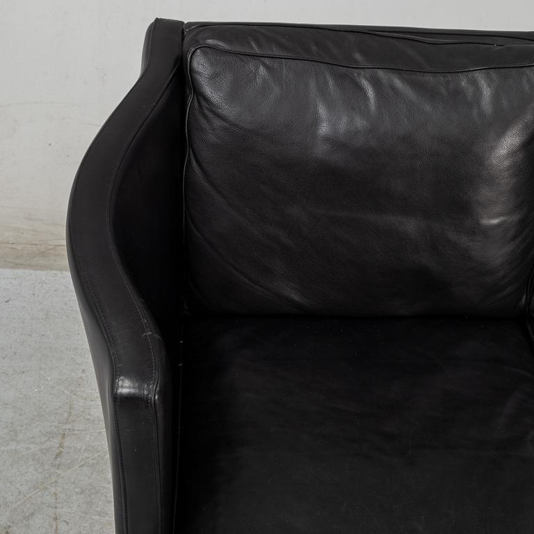 An 'AV59' sofa by Arne Vodder, Nielaus, Denmark.