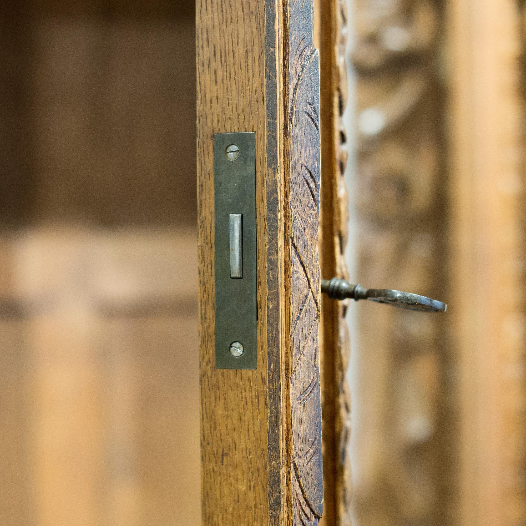 a oak vitrine cabinet from the late 1800's.