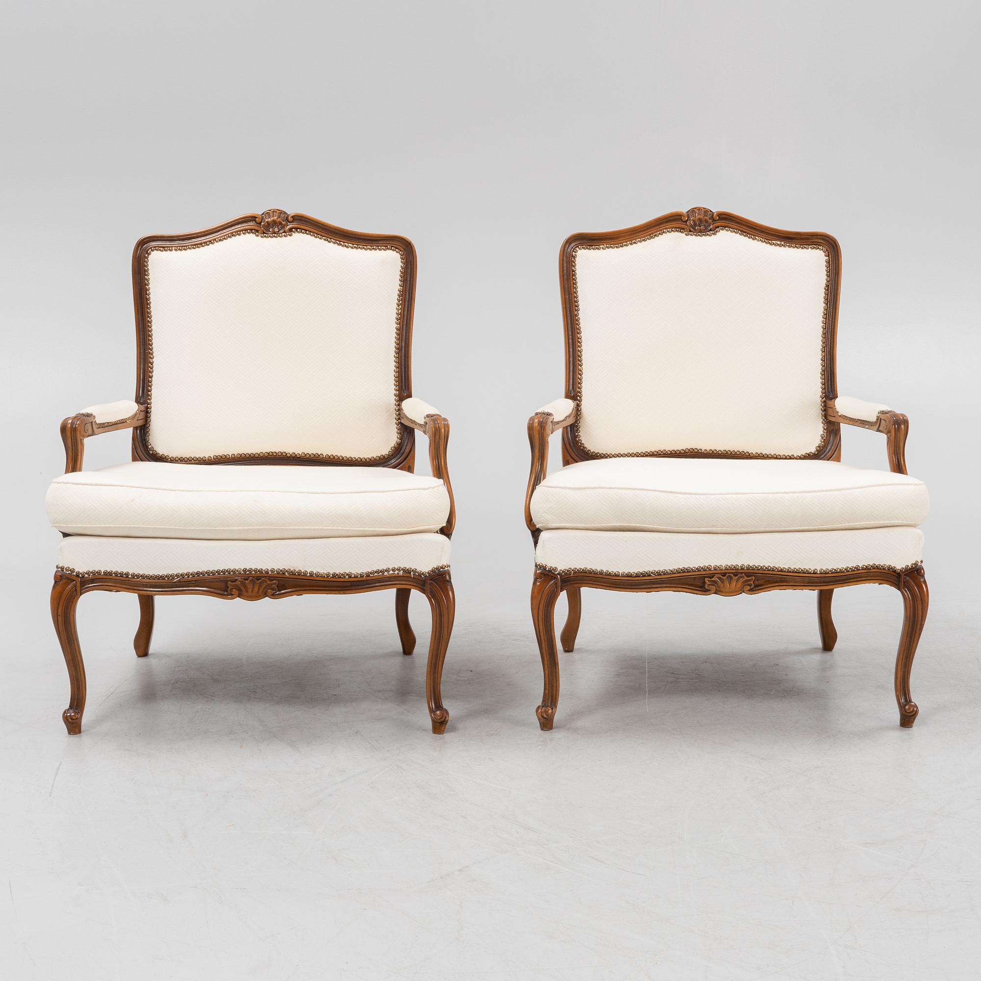 A pair of Rococo style armchairs, later part of the 20th century.