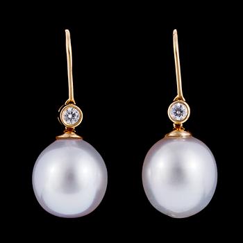 1298. A pair of cultured South sea pearl, 13 mm, and brilliant cut diamond earrings, tot. 0 .23 cts.