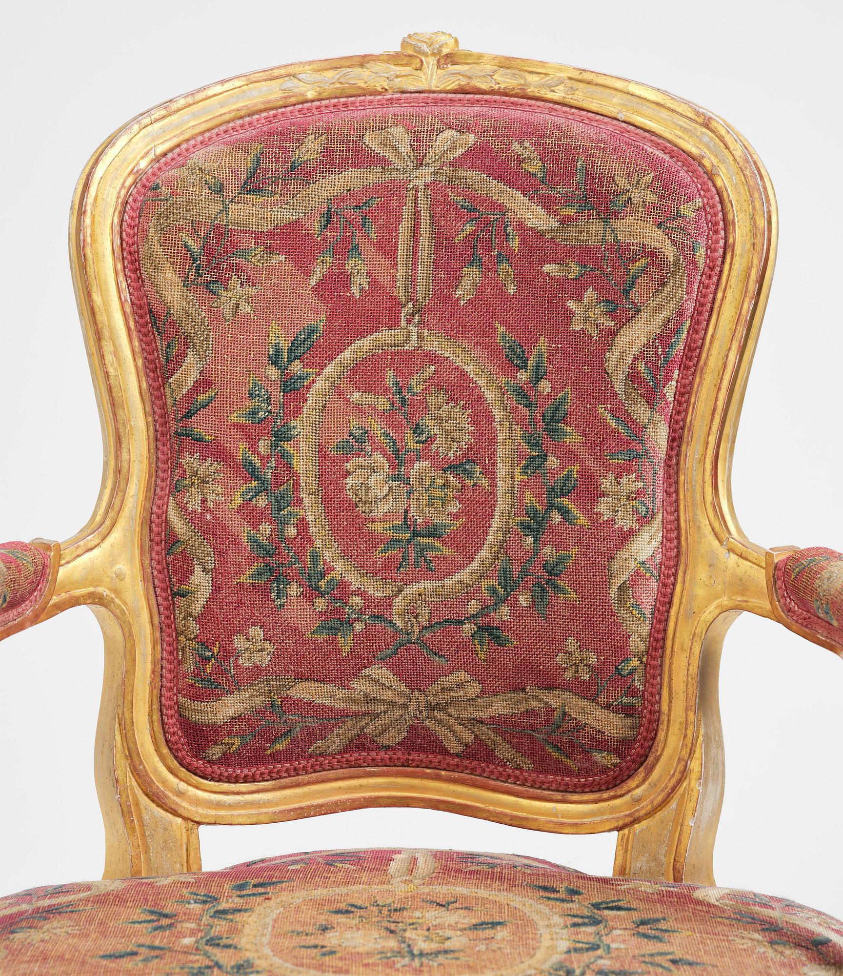 A pair of Gustavian giltwood open armchairs, Stockholm, late 18th century.